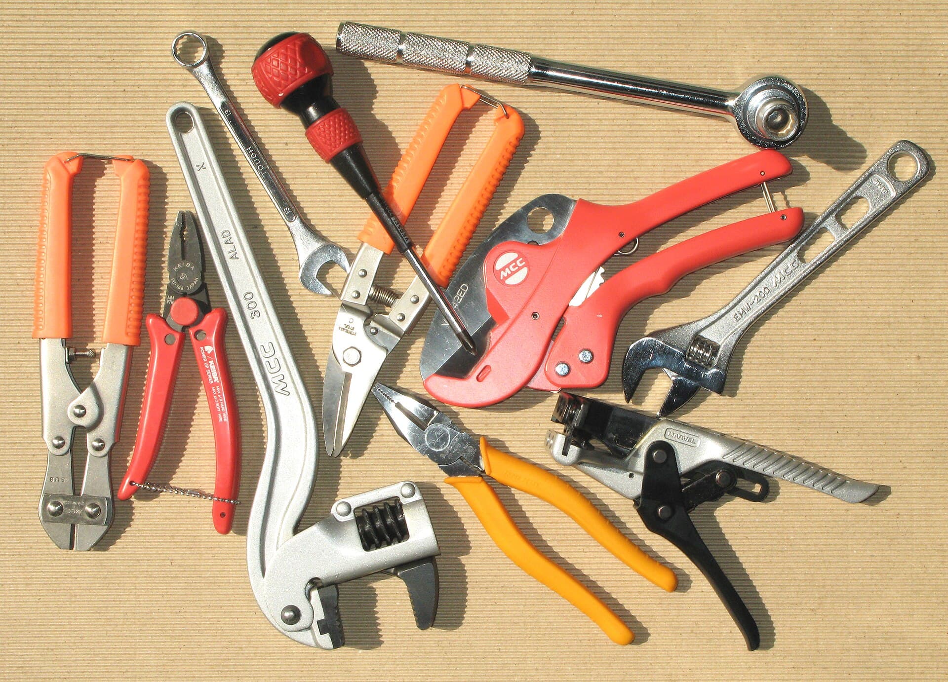 Hand tools laid out on a timber workbench